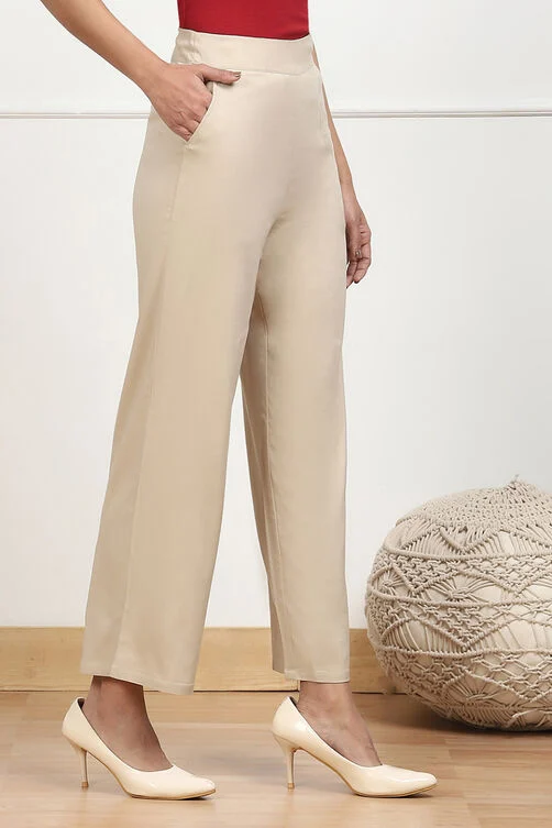 Women Beige Solid Stretchable Relaxed Fit Pants