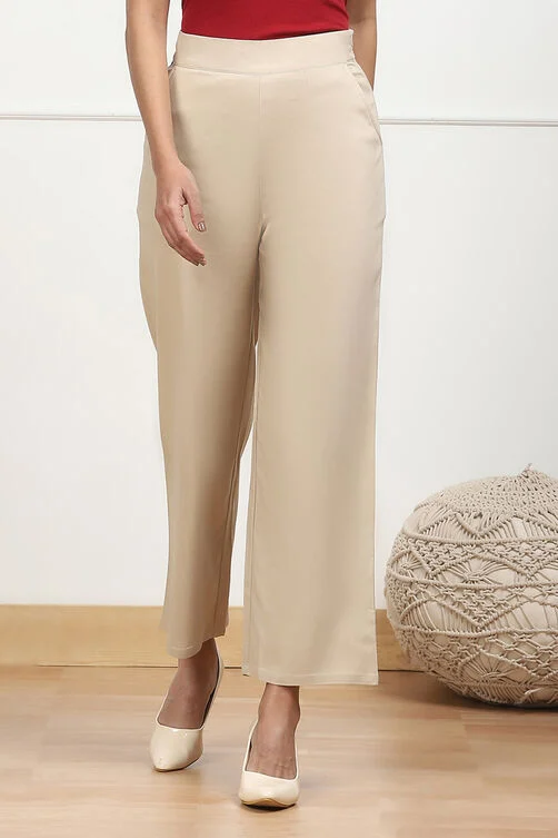 Women Beige Solid Stretchable Relaxed Fit Pants - Image 3