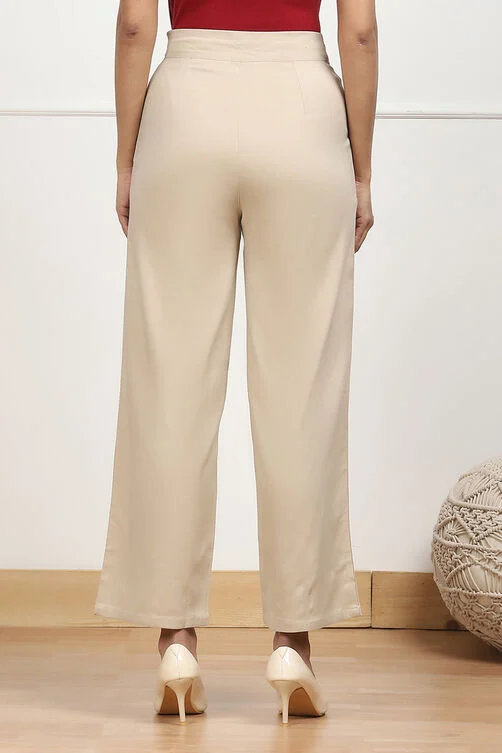 Women Beige Solid Stretchable Relaxed Fit Pants - Image 2